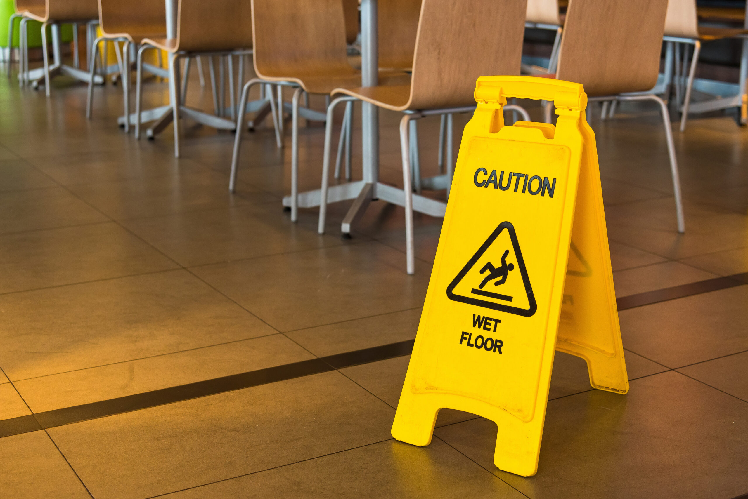 wet floor sign in restaurant after floor cleaning